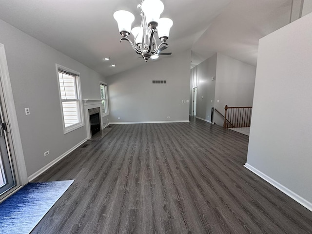 4075 Peartree Dr, Lake In The Hills, IL 60156 - unfurnished living room with a chandelier, vaulted ceiling, dark wood finished floors, and a premium fireplace