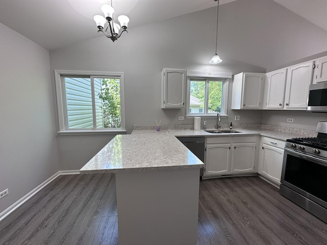 4075 Peartree Dr, Lake In The Hills, IL 60156 - kitchen featuring appliances with stainless steel finishes, lofted ceiling, a peninsula, light countertops, and white cabinetry
