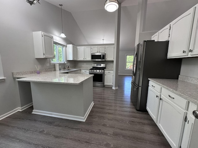 4075 Peartree Dr, Lake In The Hills, IL 60156 - kitchen with stainless steel appliances, a peninsula, high vaulted ceiling, white cabinets, and plenty of natural light