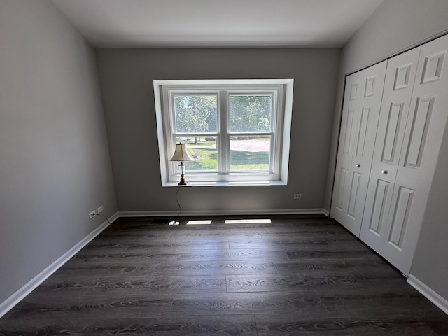 4075 Peartree Dr, Lake In The Hills, IL 60156 - unfurnished bedroom featuring dark wood-type flooring and a closet