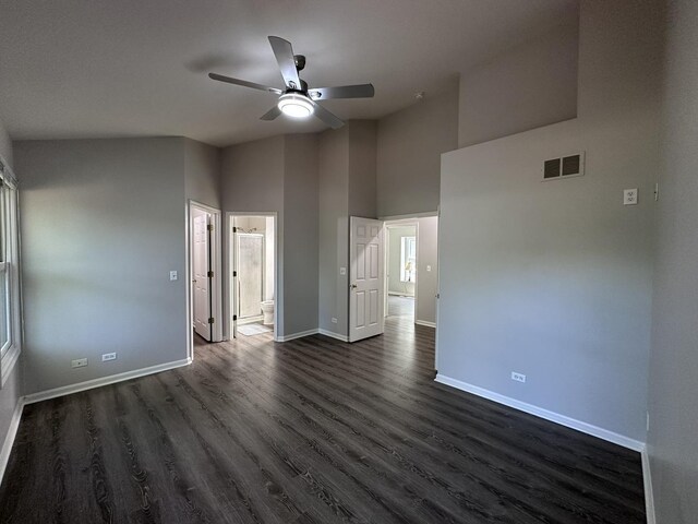 4075 Peartree Dr, Lake In The Hills, IL 60156 - empty room with ceiling fan, dark wood-style floors, and a towering ceiling