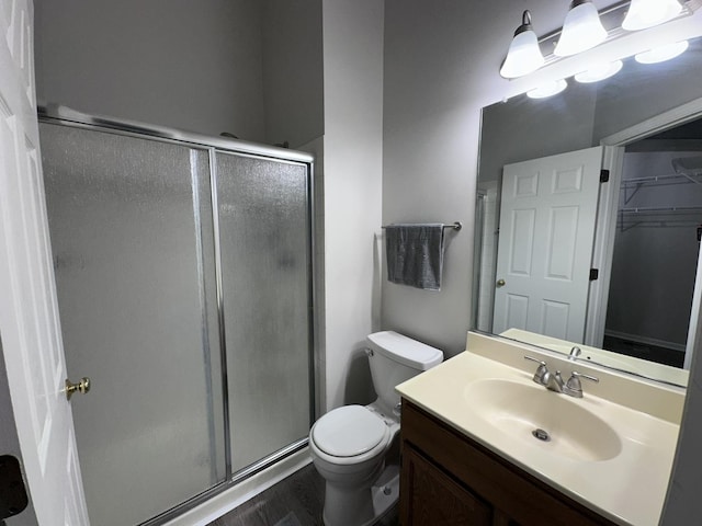 4075 Peartree Dr, Lake In The Hills, IL 60156 - full bath with a stall shower, vanity, a spacious closet, and wood finished floors