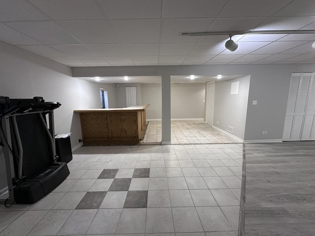 4075 Peartree Dr, Lake In The Hills, IL 60156 - finished below grade area with a drop ceiling, bar, and light tile patterned floors