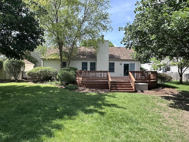 4075 Peartree Dr, Lake In The Hills, IL 60156 - rear view of house with a deck, a yard, a chimney, and roof with shingles