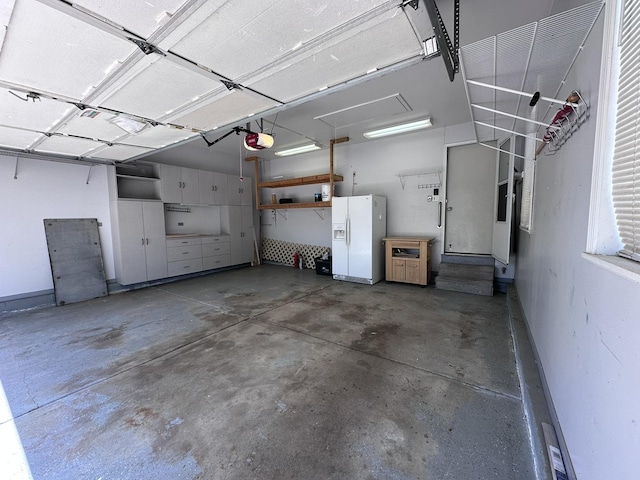 4075 Peartree Dr, Lake In The Hills, IL 60156 - garage with white fridge with ice dispenser and a garage door opener