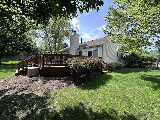 4075 Peartree Dr, Lake In The Hills, IL 60156 - back of property with a wooden deck, a chimney, and roof with shingles