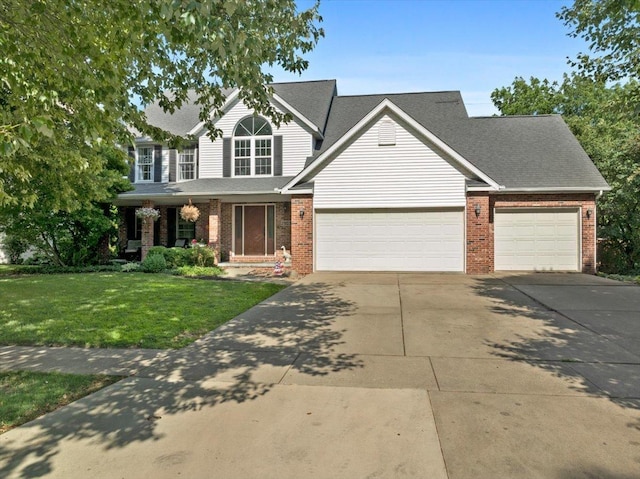 2903 Keystone Rd, Bloomington, IL 61704 - traditional-style house featuring brick siding, a garage, a front lawn, concrete driveway, and a shingled roof