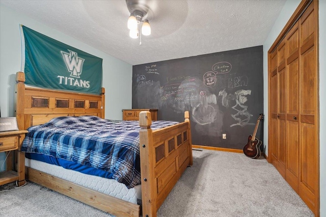 2903 Keystone Rd, Bloomington, IL 61704 - carpeted bedroom featuring a textured ceiling and a ceiling fan