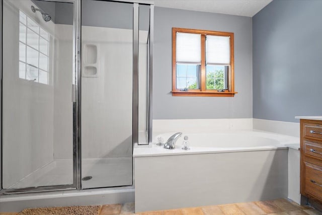 2903 Keystone Rd, Bloomington, IL 61704 - bathroom with a stall shower, a bath, and vanity