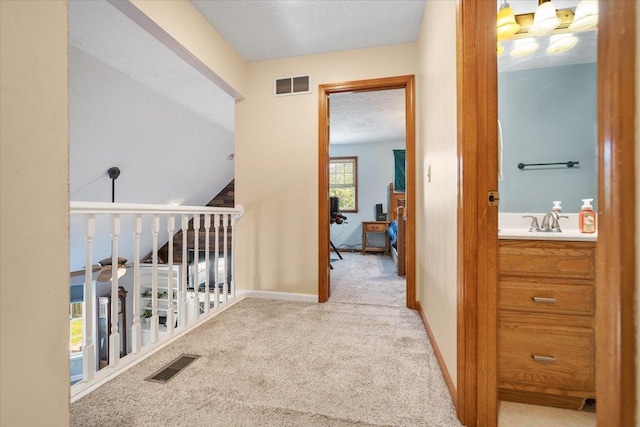 2903 Keystone Rd, Bloomington, IL 61704 - hall with carpet floors and a sink