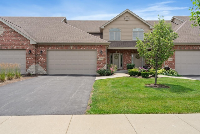 14903 S Preserve Dr, Lockport, IL 60441 - traditional-style house featuring roof with shingles, asphalt driveway, brick siding, a garage, and a front yard
