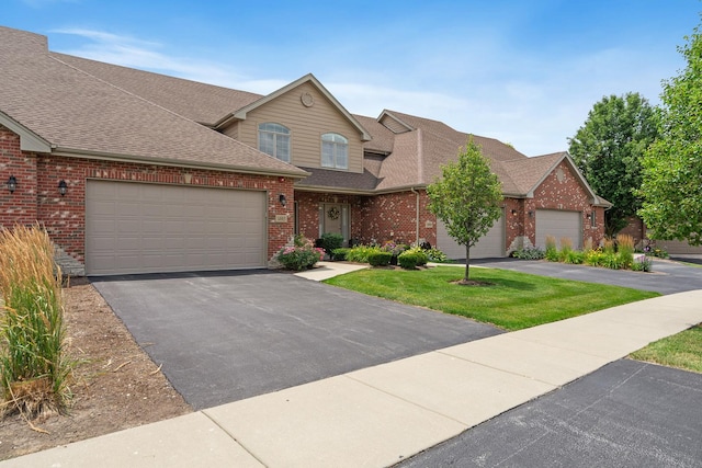 14903 S Preserve Dr, Lockport, IL 60441 - traditional-style house with brick siding, a shingled roof, an attached garage, driveway, and a front lawn