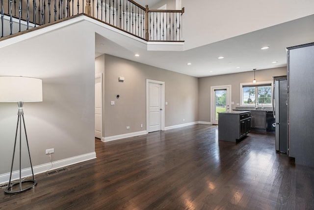 14903 S Preserve Dr, Lockport, IL 60441 - unfurnished living room with dark wood-style flooring, recessed lighting, and a high ceiling