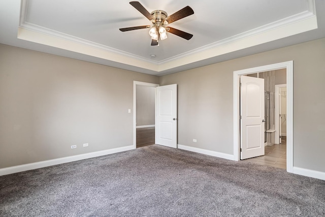 14903 S Preserve Dr, Lockport, IL 60441 - unfurnished bedroom featuring a tray ceiling, carpet, ornamental molding, and ceiling fan