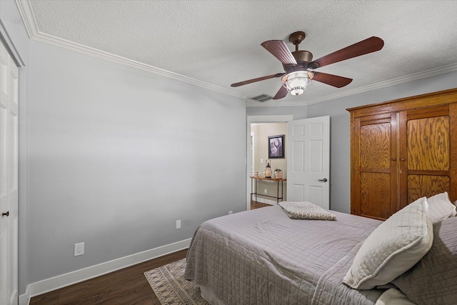 2911 E Oaks Rd N, Urbana, IL 61802 - bedroom with dark wood-style flooring, crown molding, a ceiling fan, and a textured ceiling