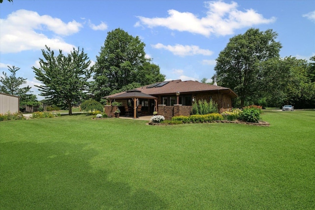 2911 E Oaks Rd N, Urbana, IL 61802 - rear view of house featuring a gazebo, a lawn, a patio area, and brick siding