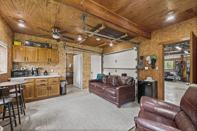 2911 E Oaks Rd N, Urbana, IL 61802 - living area featuring a wooden ceiling with exposed beams, ceiling fan, concrete floors, and a garage