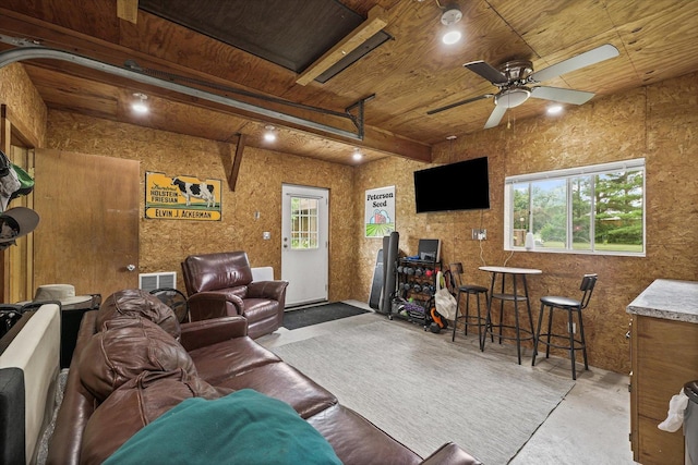 2911 E Oaks Rd N, Urbana, IL 61802 - living room with plenty of natural light, a wooden ceiling with exposed beams, concrete floors, and a ceiling fan