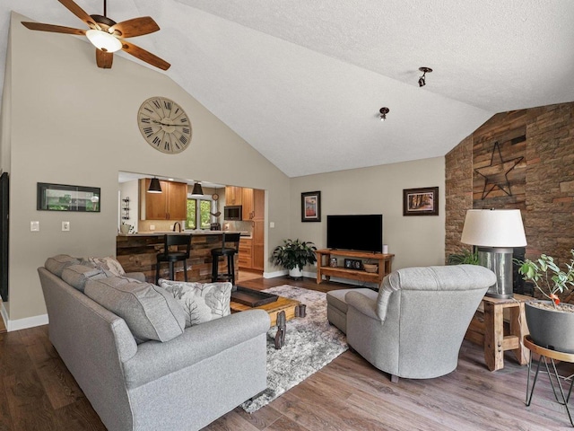 2911 E Oaks Rd N, Urbana, IL 61802 - living area featuring high vaulted ceiling, a ceiling fan, and wood finished floors