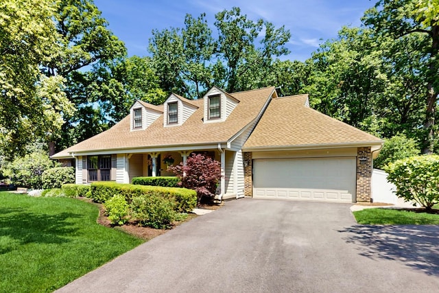 39 Keswick Ct, Lincolnshire, IL 60069 - cape cod home with a shingled roof, driveway, a garage, and a front lawn