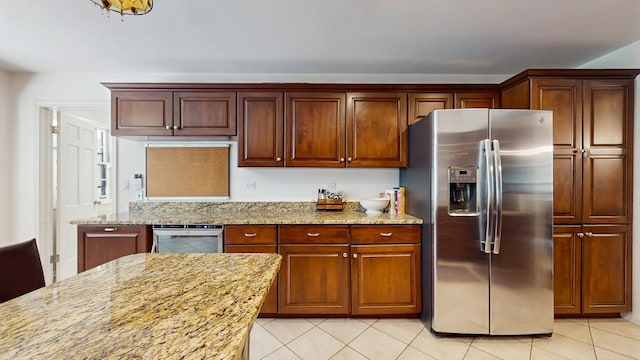 39 Keswick Ct, Lincolnshire, IL 60069 - kitchen featuring stainless steel refrigerator with ice dispenser, light tile patterned floors, and light stone counters
