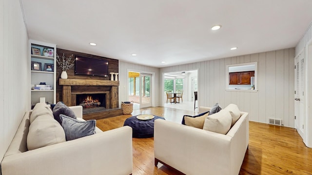 39 Keswick Ct, Lincolnshire, IL 60069 - living area with a large fireplace, light wood-style floors, and recessed lighting