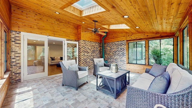 39 Keswick Ct, Lincolnshire, IL 60069 - sunroom featuring a skylight, outdoor lounge area, wood ceiling, wooden walls, and ceiling fan