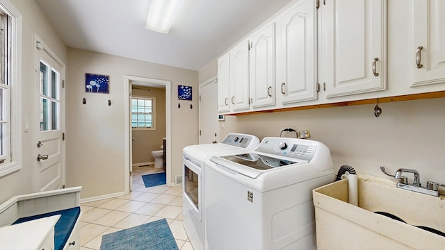 39 Keswick Ct, Lincolnshire, IL 60069 - laundry room with cabinet space, washing machine and clothes dryer, and light tile patterned flooring