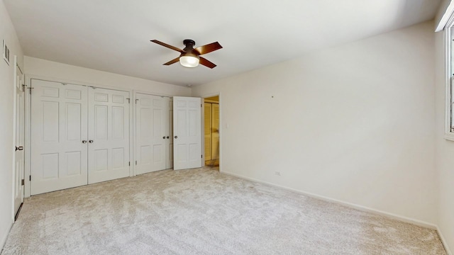 39 Keswick Ct, Lincolnshire, IL 60069 - unfurnished bedroom featuring carpet floors, multiple closets, and ceiling fan