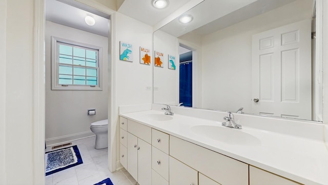 39 Keswick Ct, Lincolnshire, IL 60069 - bathroom with double vanity, marble finish floors, and recessed lighting