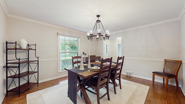39 Keswick Ct, Lincolnshire, IL 60069 - dining space featuring a chandelier, wood finished floors, and ornamental molding