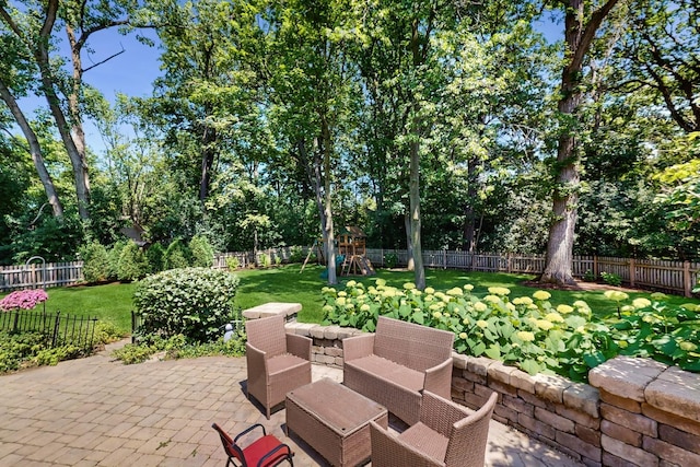39 Keswick Ct, Lincolnshire, IL 60069 - fenced backyard featuring a patio, a playground, and view of wooded area