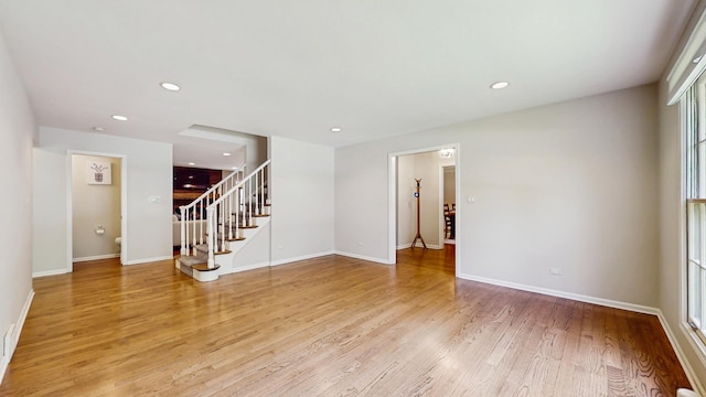 39 Keswick Ct, Lincolnshire, IL 60069 - unfurnished room with stairway, light wood-style flooring, and recessed lighting