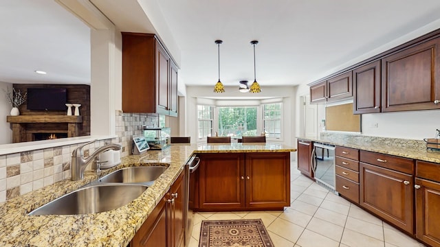39 Keswick Ct, Lincolnshire, IL 60069 - kitchen featuring a peninsula, backsplash, light tile patterned flooring, and a lit fireplace