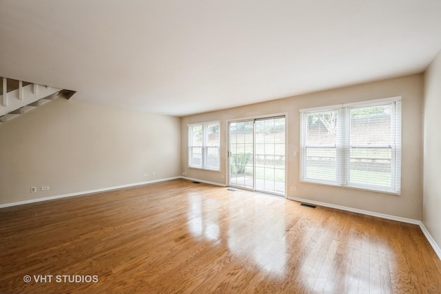276 Greensboro Ct, Elk Grove Village, IL 60007 - unfurnished living room featuring wood finished floors and stairs