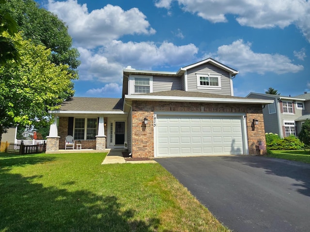 1873 Baldwin Way, Bolingbrook, IL 60490 - view of front of home with driveway, a garage, brick siding, and covered porch