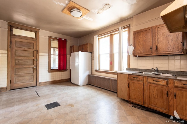 2339 S 61st Ave, Cicero, IL 60804 - kitchen featuring freestanding refrigerator, radiator heating unit, range hood, and healthy amount of natural light