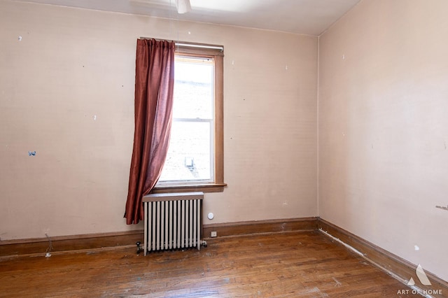 2339 S 61st Ave, Cicero, IL 60804 - empty room with radiator heating unit and wood finished floors