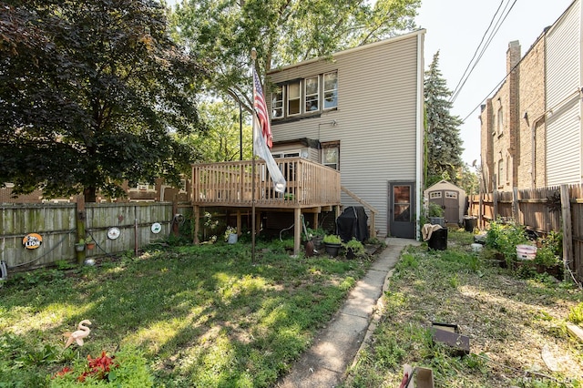2339 S 61st Ave, Cicero, IL 60804 - back of property with a storage unit, a wooden deck, and a fenced backyard