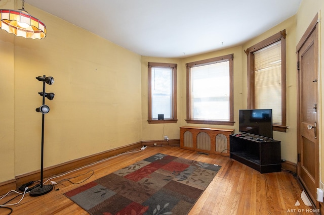 2339 S 61st Ave, Cicero, IL 60804 - unfurnished living room with wood finished floors and baseboards