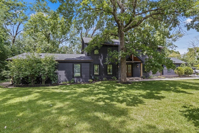 692 S Waukegan Rd, Lake Forest, IL 60045 - view of front of house with a front lawn and roof with shingles