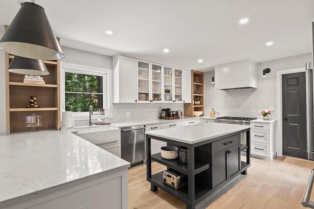 692 S Waukegan Rd, Lake Forest, IL 60045 - kitchen with open shelves, stainless steel appliances, decorative backsplash, white cabinets, and dark cabinetry