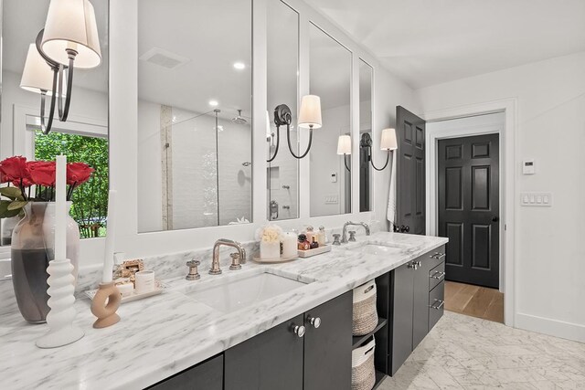 692 S Waukegan Rd, Lake Forest, IL 60045 - bathroom with a shower stall, double vanity, and marble finish floors
