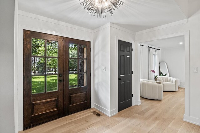 692 S Waukegan Rd, Lake Forest, IL 60045 - foyer entrance with french doors and light wood-style floors