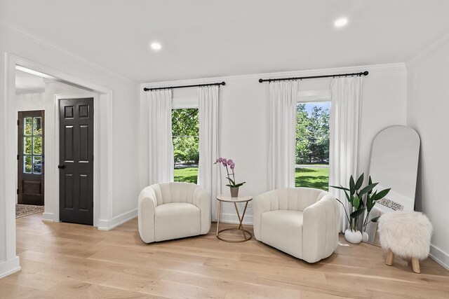 692 S Waukegan Rd, Lake Forest, IL 60045 - living area with healthy amount of natural light, ornamental molding, light wood-type flooring, and recessed lighting