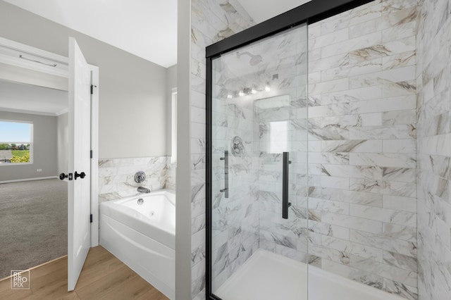 14530 General Dr, Plainfield, IL 60544 - bathroom with a bath, a shower stall, and wood finished floors