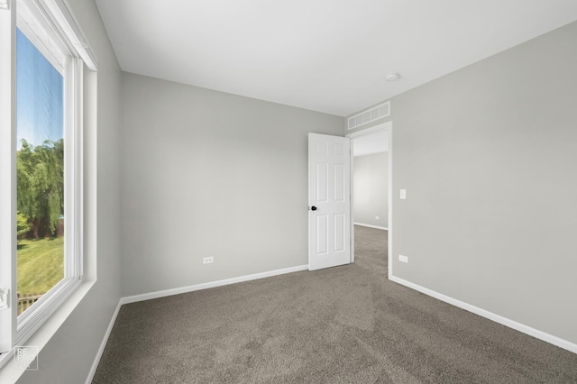 14530 General Dr, Plainfield, IL 60544 - carpeted spare room featuring baseboards and a smoke detector