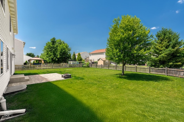 14530 General Dr, Plainfield, IL 60544 - fenced backyard with a patio area and an outdoor fire pit