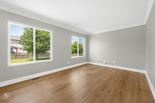 14530 General Dr, Plainfield, IL 60544 - empty room featuring ornamental molding and wood finished floors