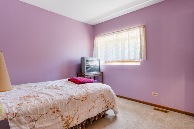 2180 Newport Cir, Hanover Park, IL 60133 - carpeted bedroom featuring baseboards